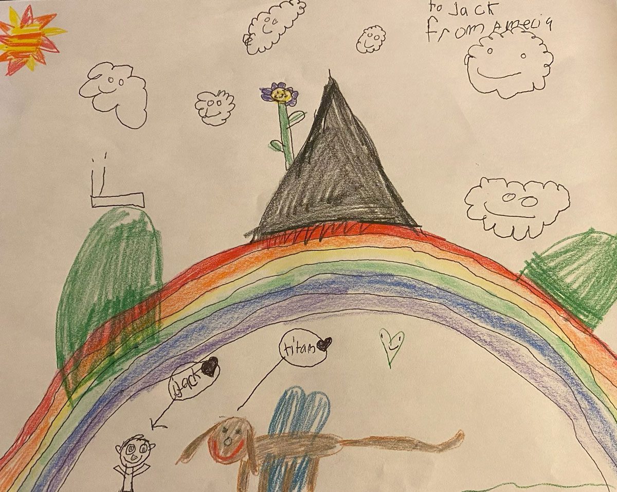 child's artwork of large rainbow, mountains, happy clouds and sun with a child and dog with wings underneath; the dog is labelled "Titan" and the child is labelled "Jack"; in the upper right-hand corner it says "to Jack from Amecia"